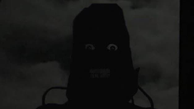 Tall and scary monster standing outside of a window.